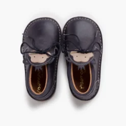 Botita piel cordones cara monito