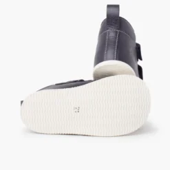 Botita piel sport puntera blanca