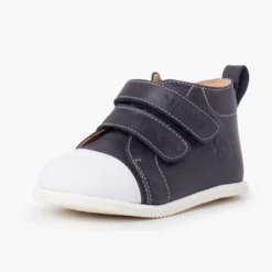 Botita piel sport puntera blanca
